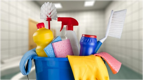 Technician handling cleaning chemicals safely during carpet cleaning