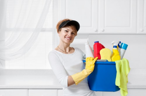 Cleaner using protective gear during professional carpet cleaning